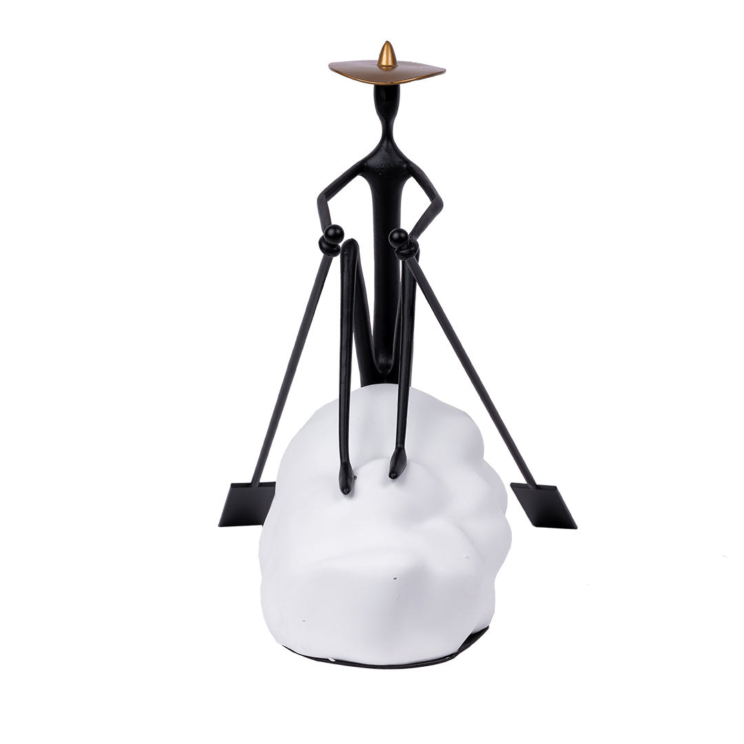 Man Sailing on boat sculpture